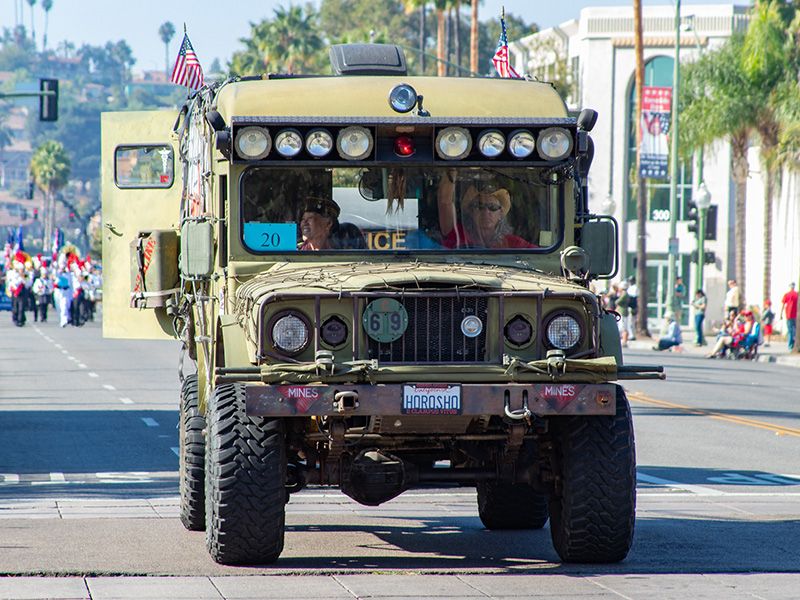 Vietnam-era War Wagon rolled down Grand Avenue carrying Gina Burke, a Vietnam War nurse